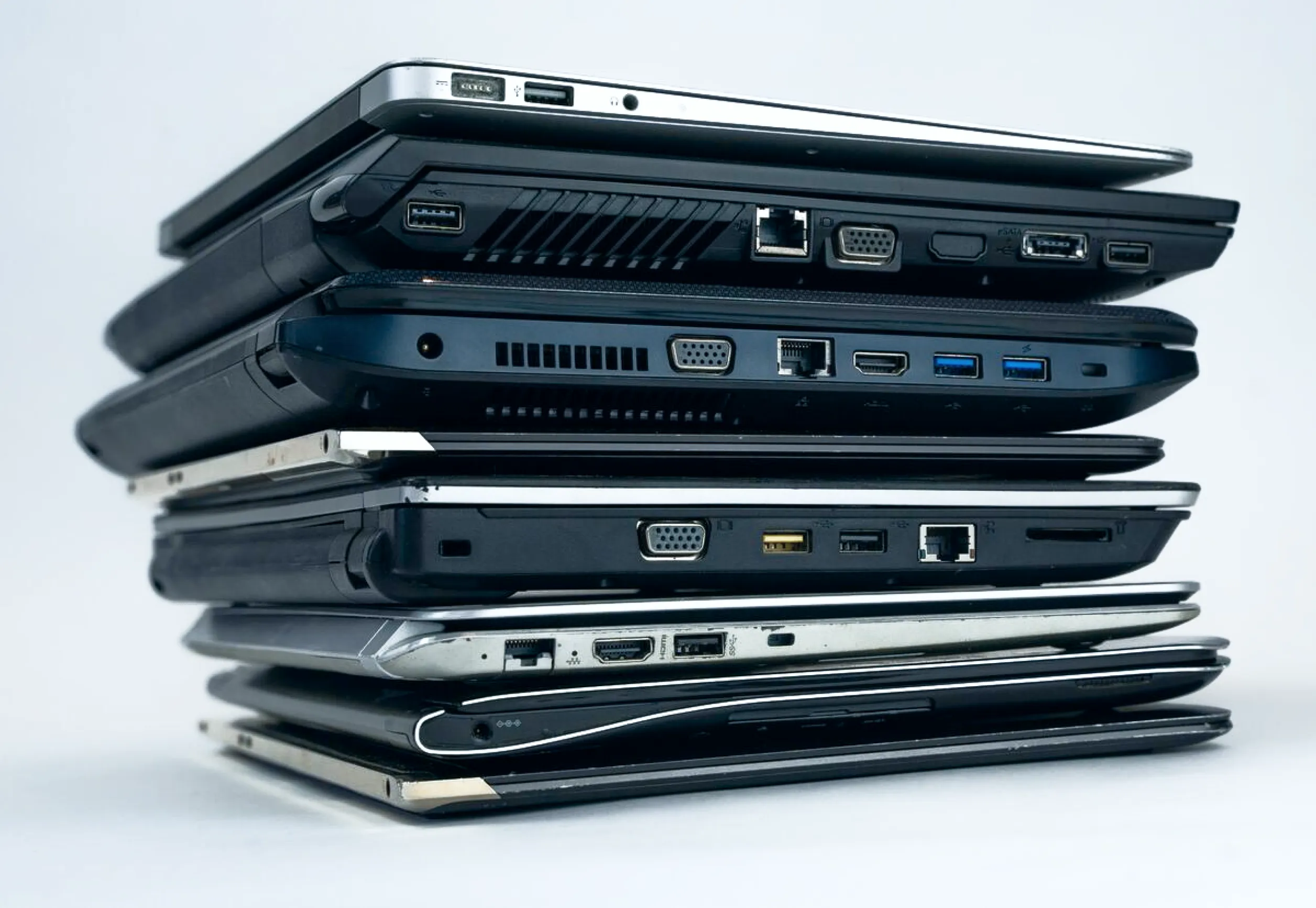 Pile of no-longer used laptops.